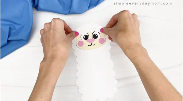 hand gluing head to Easter sheep craft
