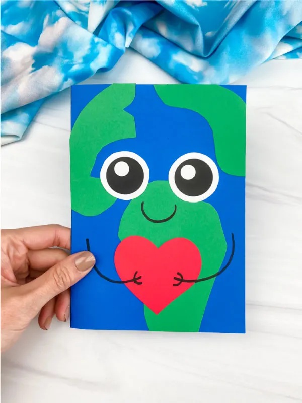 hand holding Earth card craft