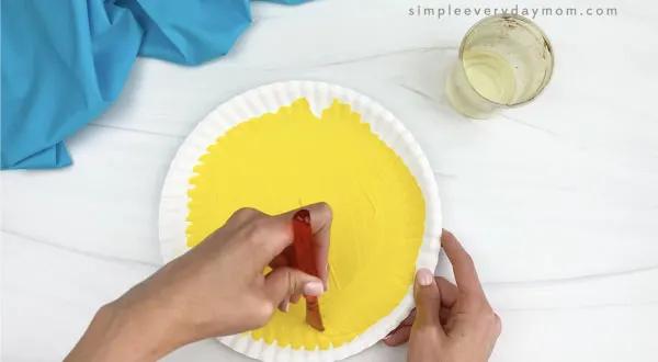 hand painting paper plate yellow