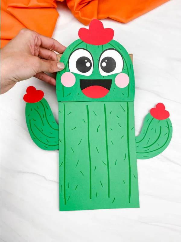 hand holding paper bag cactus craft