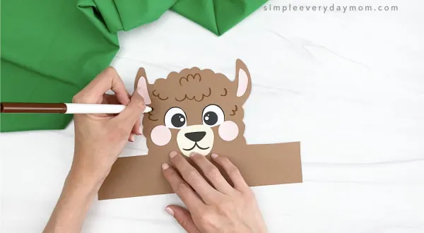 hand drawing fur on llama headband craft
