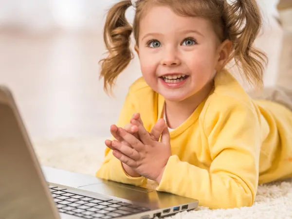 smiling girl on laptop