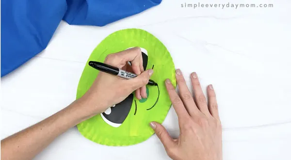 hand drawing smile on paper plate baby yoda
