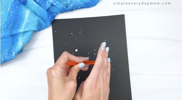 hand painting black paper