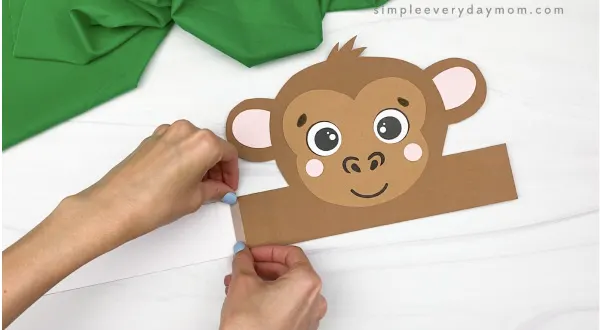 hand taping extender to monkey headband craft