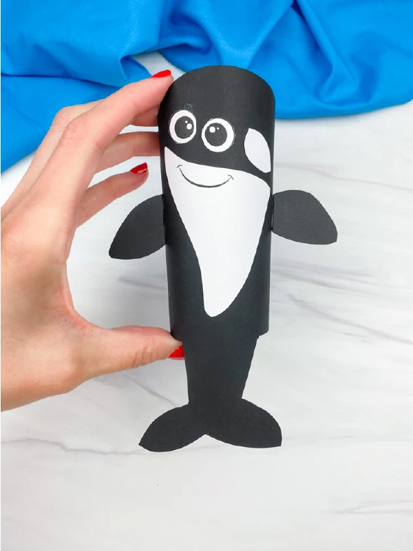 hand holding killer whale toilet paper roll craft