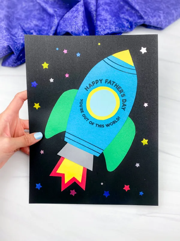 hand holding rocket father's day card