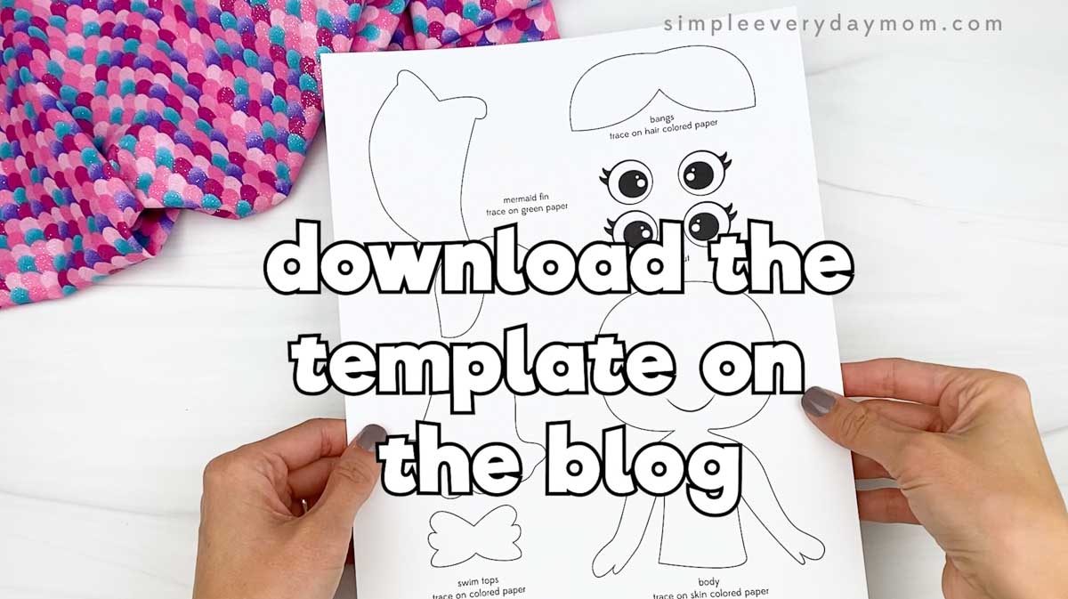 Hands hold a printed mermaid craft template with text reading “download the template on the blog.”
