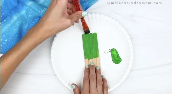 hand painting popsicle sticks green
