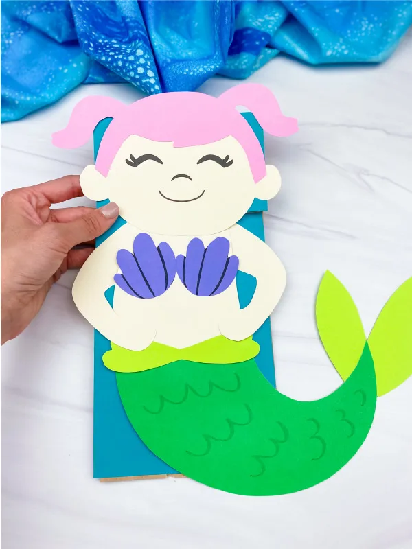 hand holding mermaid paper bag craft