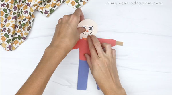 hand gluing head to printable scarecrow craft