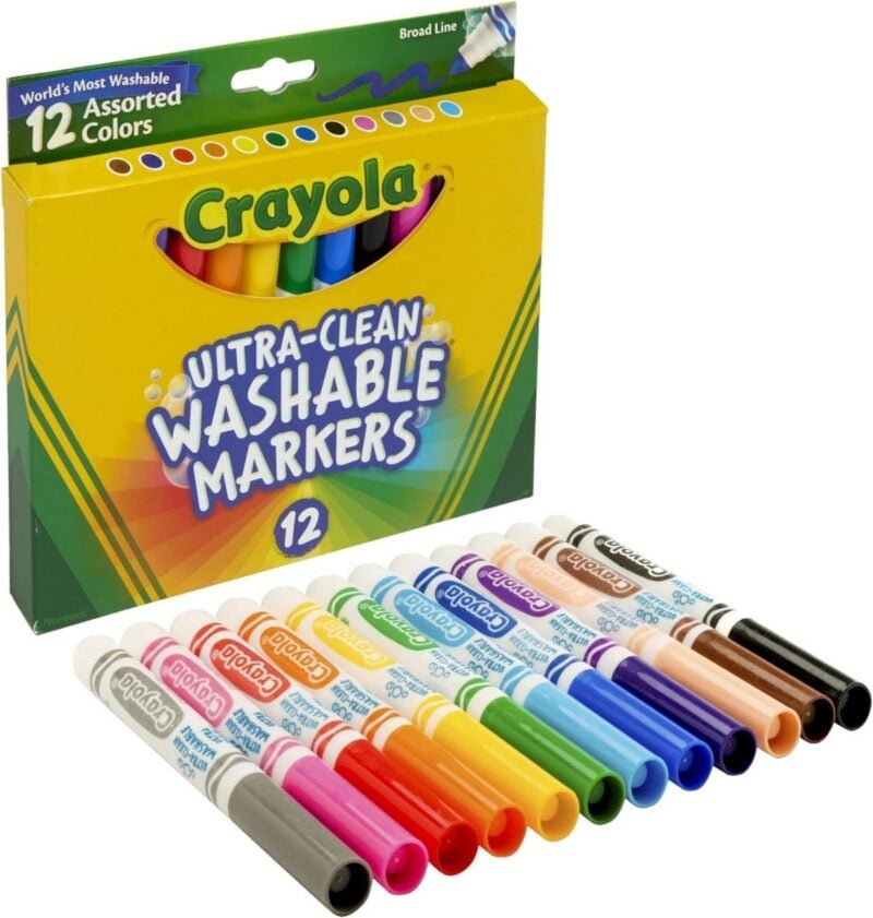 crayola marker box with markers laid out in line in front of box