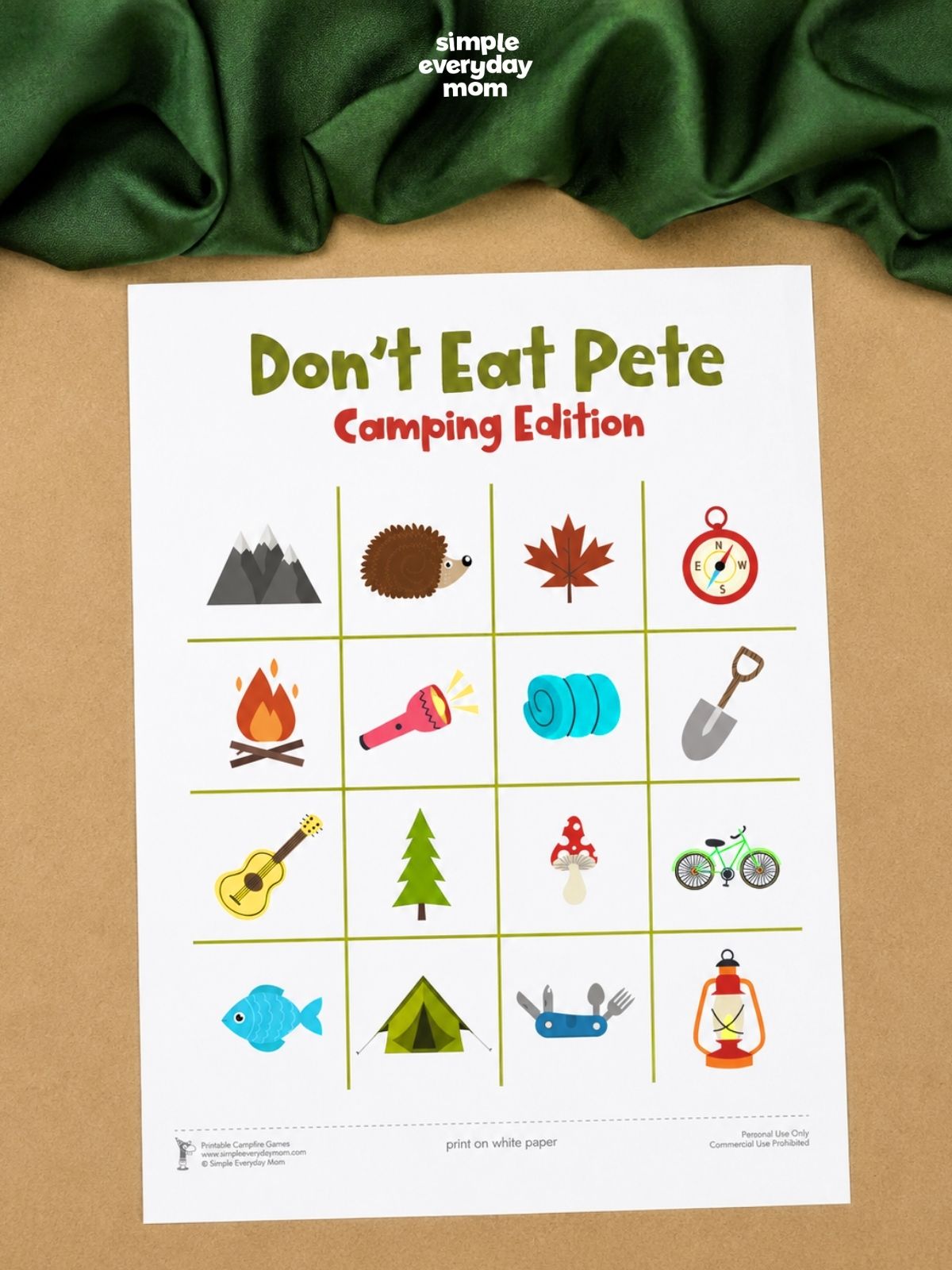 A printable "Don't Eat Pete: Camping Edition" game board displays a 4-by-4 grid of colorful camping-themed icons, including a campfire, tent, lantern, flashlight, bicycle, and mountains.
