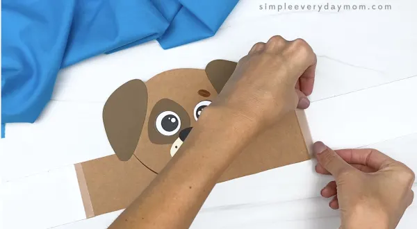 hand taping extender to dog headband craft