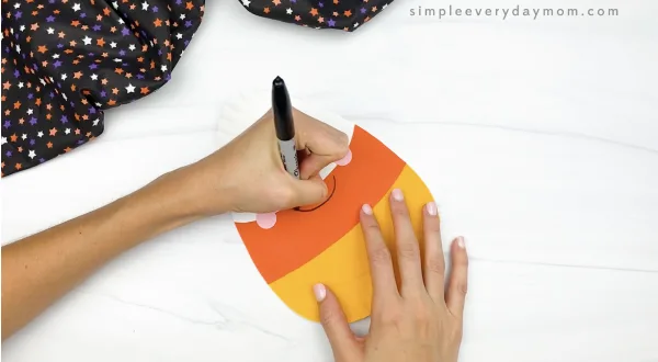 hand drawing smile on paper plate candy corn craft