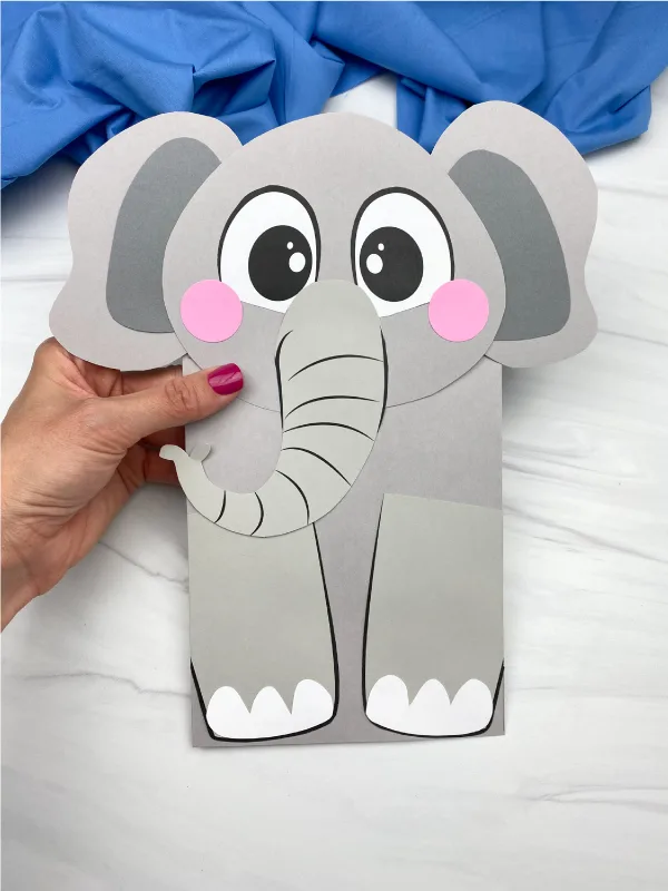 hand holding paper bag elephant craft