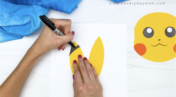 hand drawing details on paper bag Pikachu head