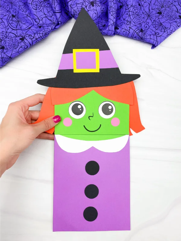 hand holding witch puppet craft