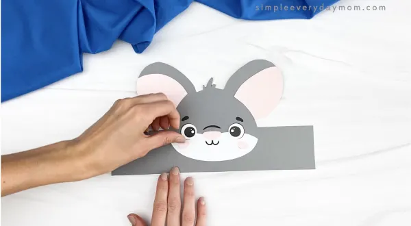 hand gluing cheek to mouse headband craft