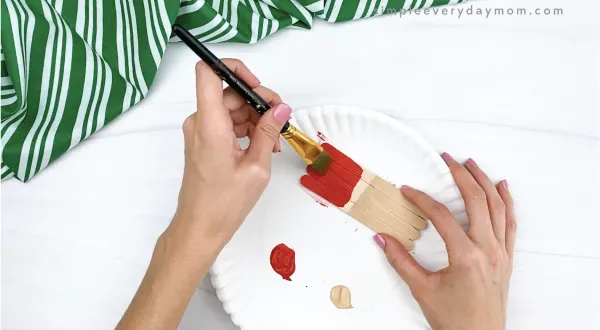 hand painting popsicle sticks red