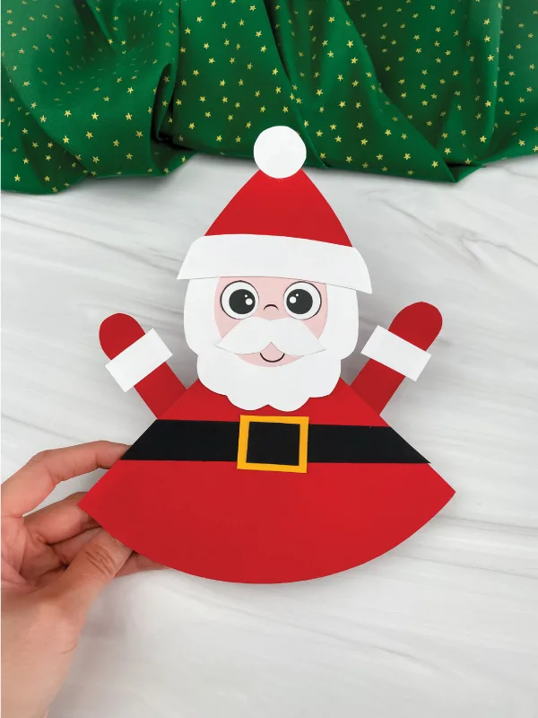 hand holding rocking Santa craft