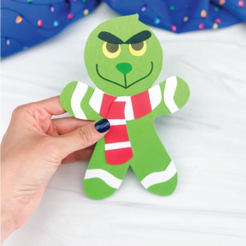 hand holding grinch gingerbread man craft