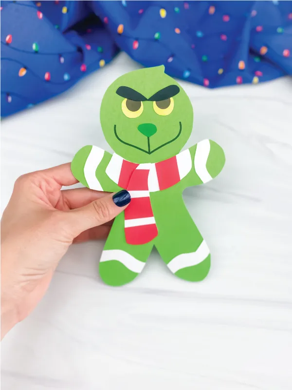 hand holding grinch gingerbread man craft
