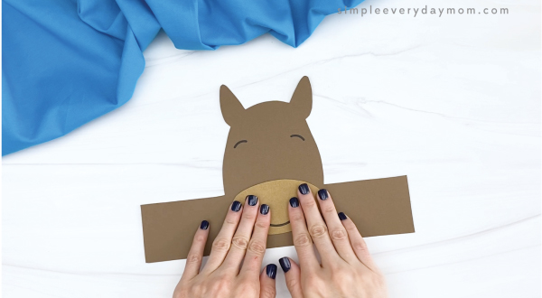 hand gluing nose and mouth to horse headband craft