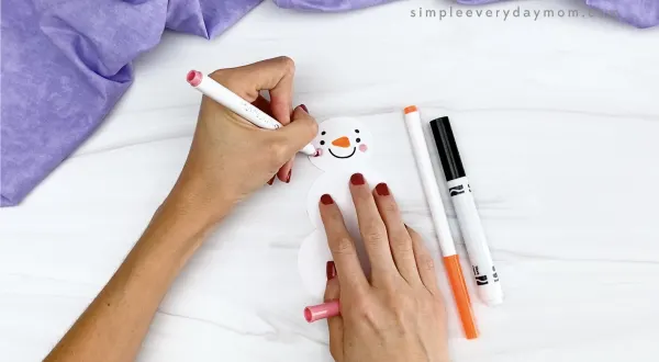 hand drawing on snowman's face