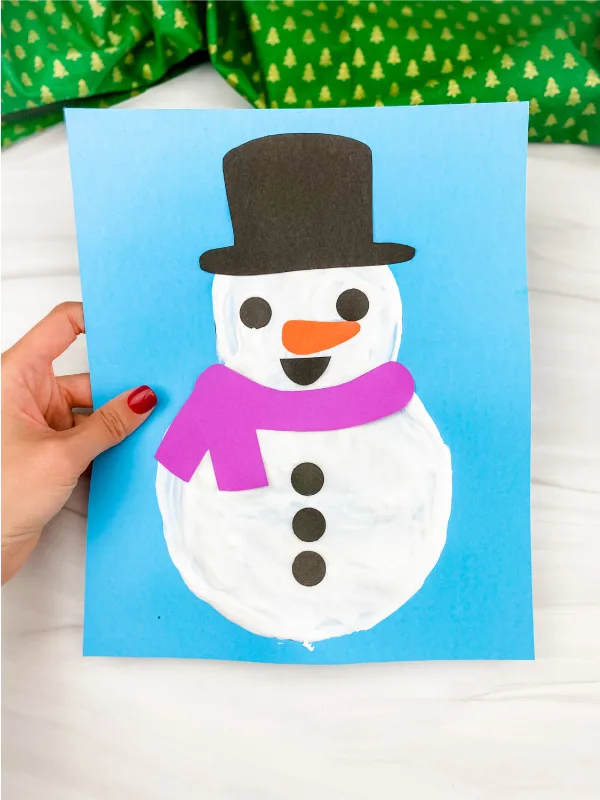 hand holding puffy paint snowman