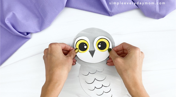 hand gluing face to printable snowy owl craft