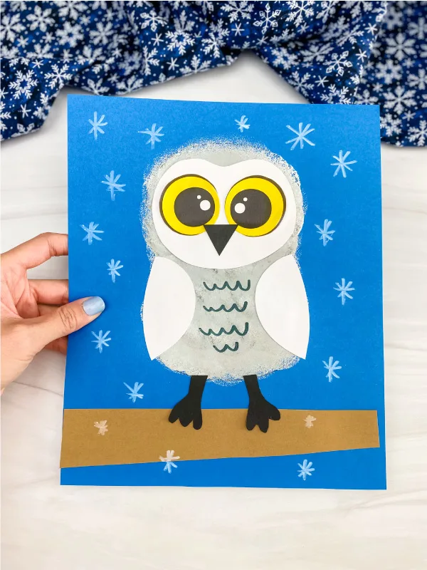 hand holding snowy owl craft