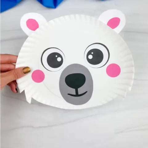 hand holding paper plate polar bear