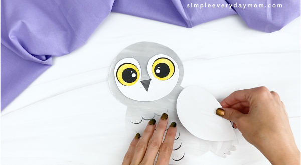 hand gluing right wing to printable snowy owl craft