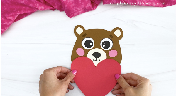 hand gluing heart to bear Valentine craft