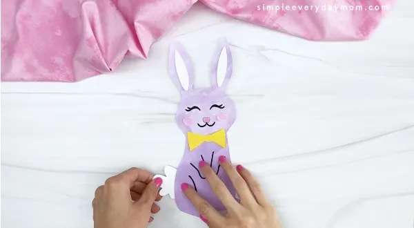 hand gluing tail to printable Easter craft