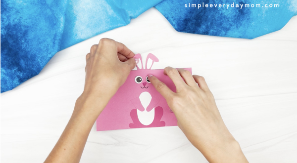 hand gluing ears to toilet roll bunny craft