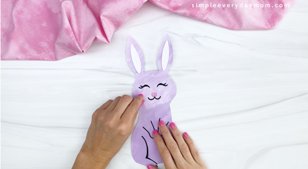 hand gluing cheek to printable Easter craft