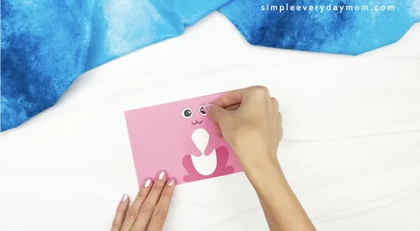 hand gluing eye to toilet roll bunny craft