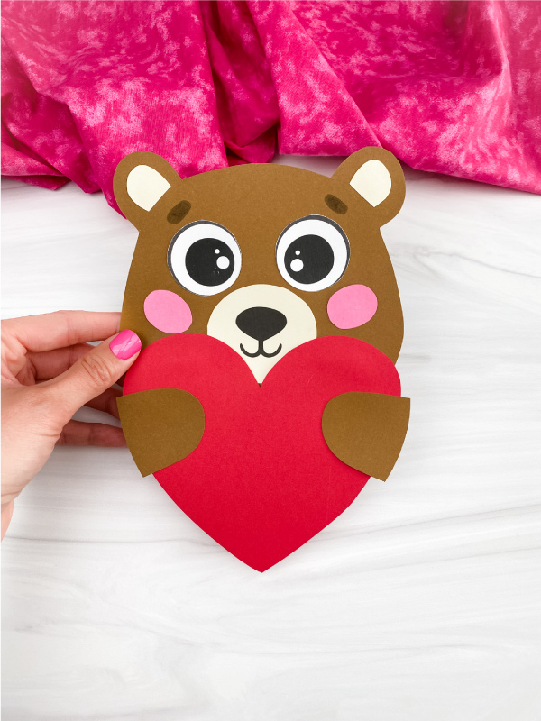 hand holding bear Valentine craft