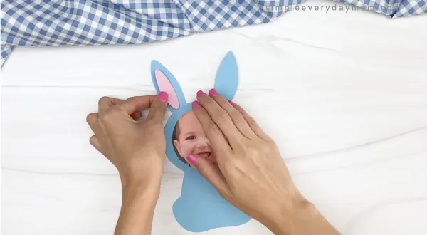 hand gluing inner ear to bunny photo craft