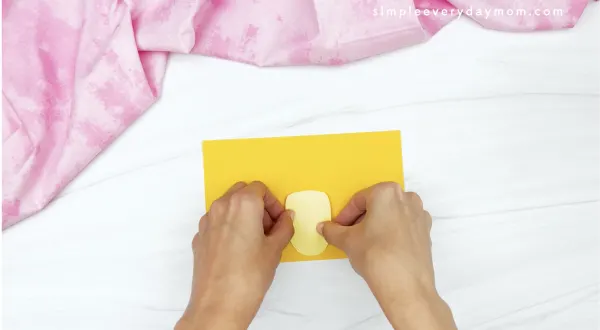 hand gluing belly to toilet roll chick craft