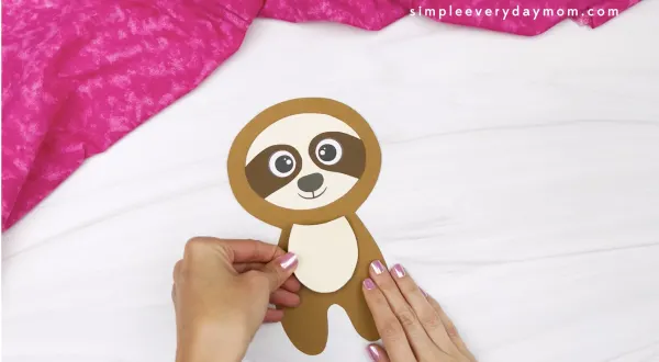 hand gluing belly to sloth Valentine craft