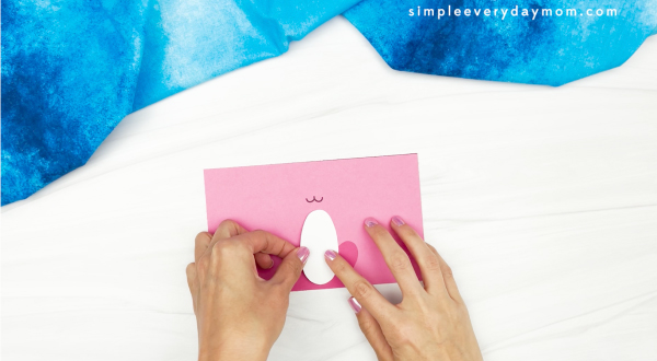 hand gluing belly to toilet roll bunny craft
