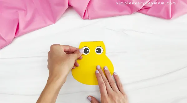hand gluing eye to Easter chick card craft