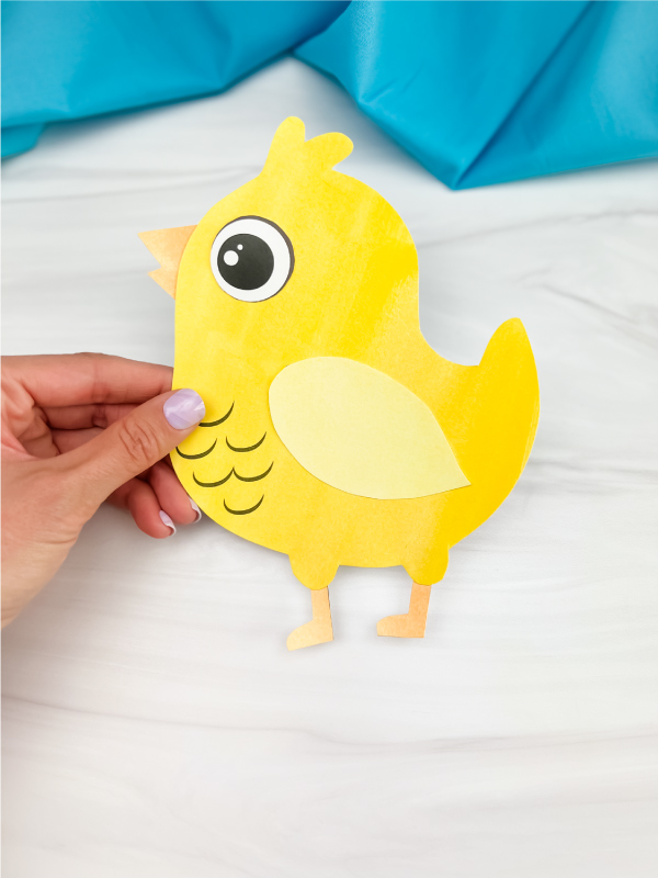 hand holding printable chick craft