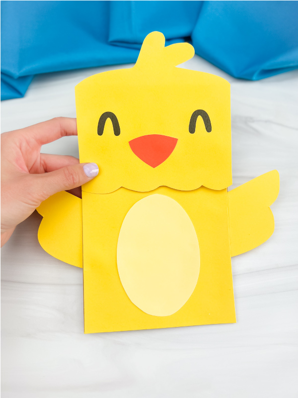 hand holding paper bag chick craft