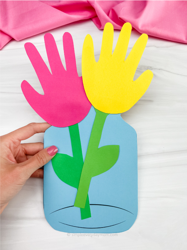 hand holding handprint flower card craft