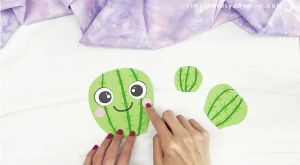 hand gluing cheek to Mother's Day cactus craft