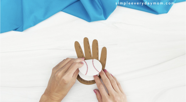 hand gluing baseball to handprint baseball card craft